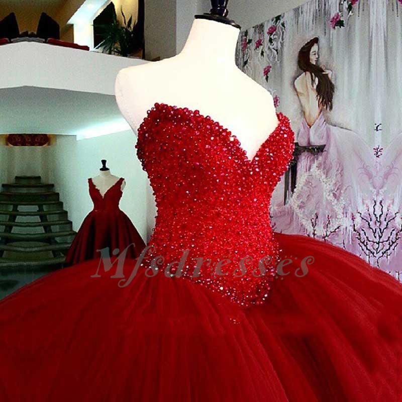 red puffy quince dresses