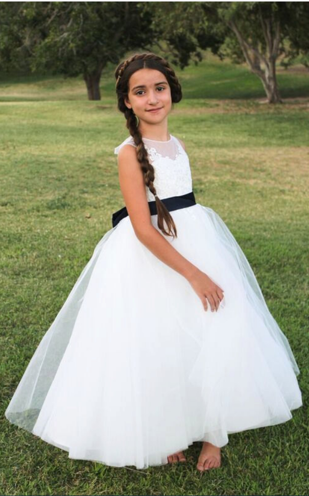 white flower girl dress with navy sash